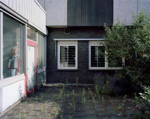 Betsy in Window, Entrance, Polaroid, Enschede, The Netherlands, 2010. © Robert Burley